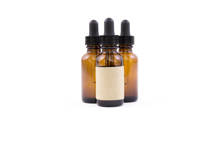 Amber glass bottles of hair and scalp oil
