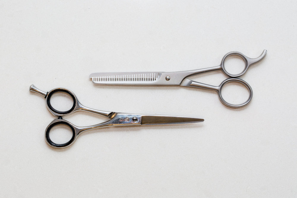 A pair of hair styling shears on a white background