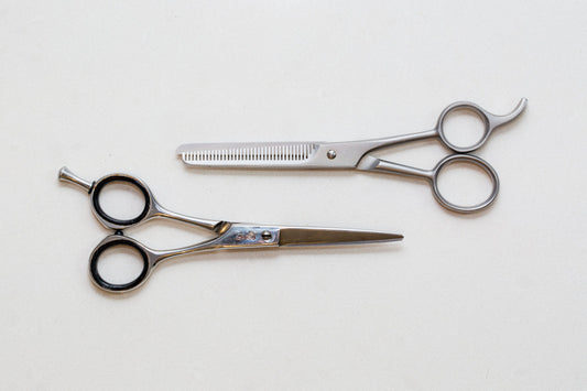 A pair of hair styling shears on a white background