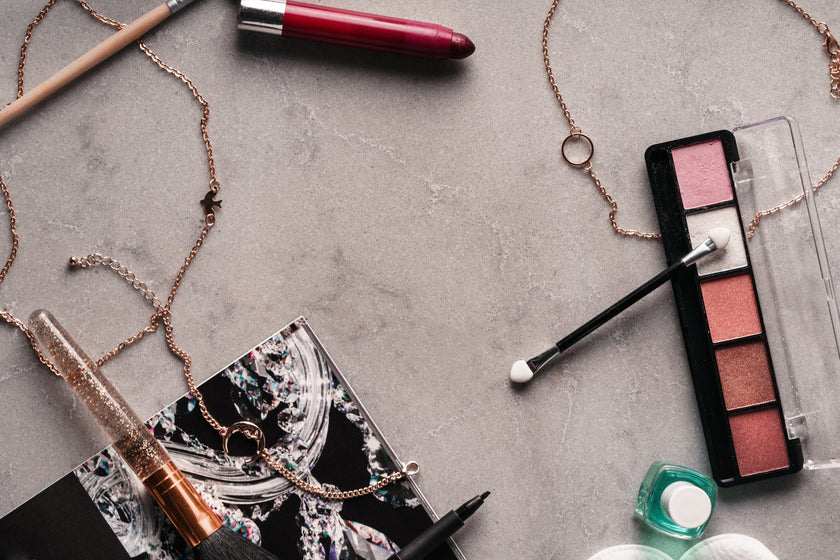An assortment of makeup and beauty products laid out together