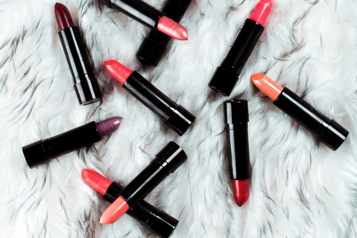 An open lipstick bullet standing upright
