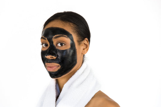A purifying face mask applied across the cheeks